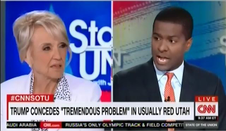 Bakari Sellers tells former Arizona Gov. Jan Brewer, right, that he hopes the Clinton campaign begins to "start talking about the millions of children that the Clinton Foundation helps around the world."